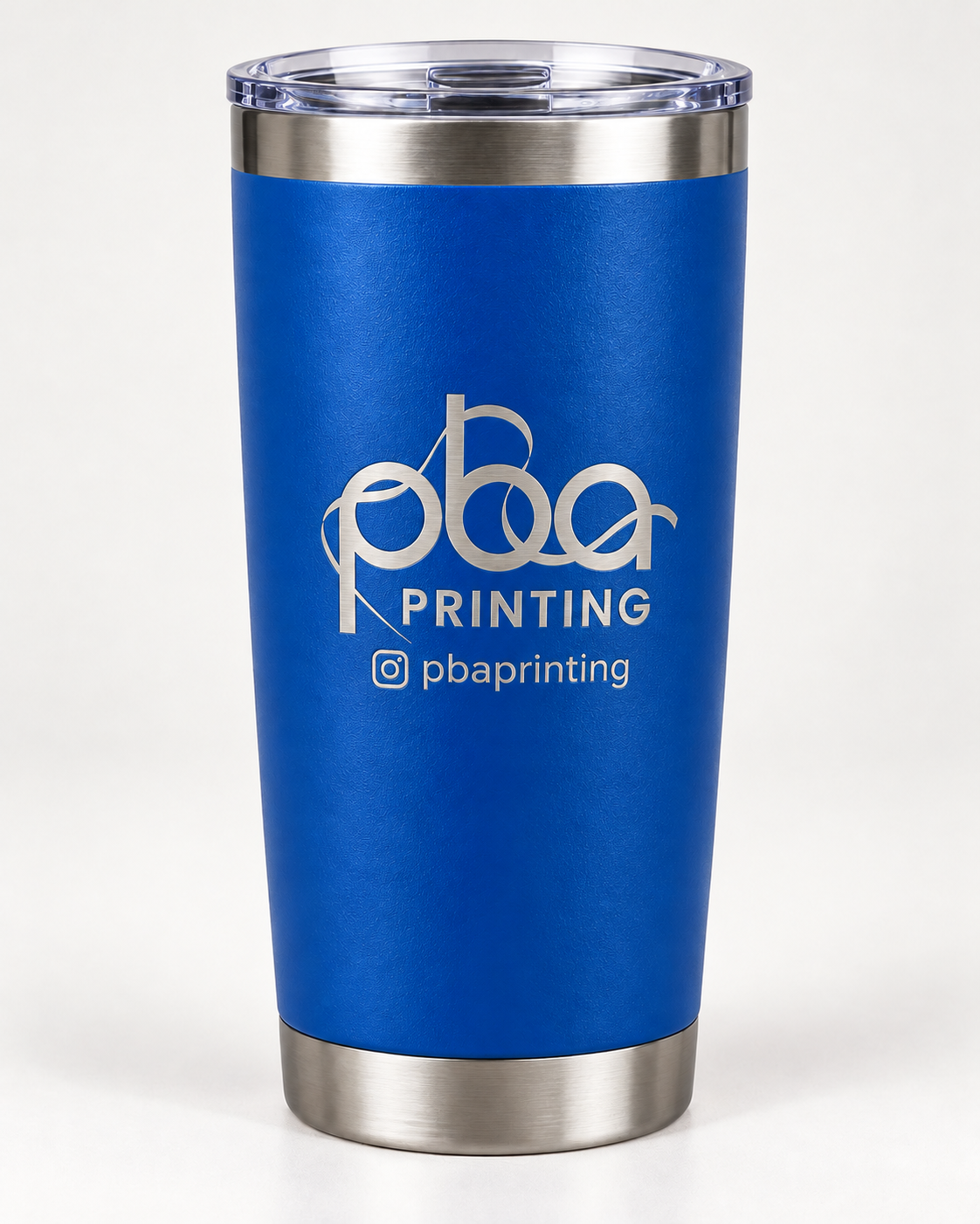 Royal blue 20 oz tumbler laser engraved with PBA Printing logo
