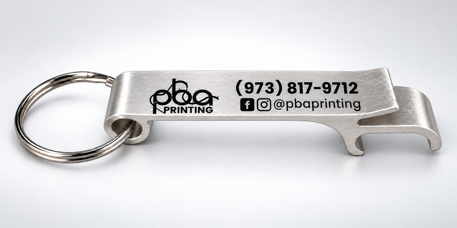 Premium studio photo of silver custom UV-printed bottle opener keychain